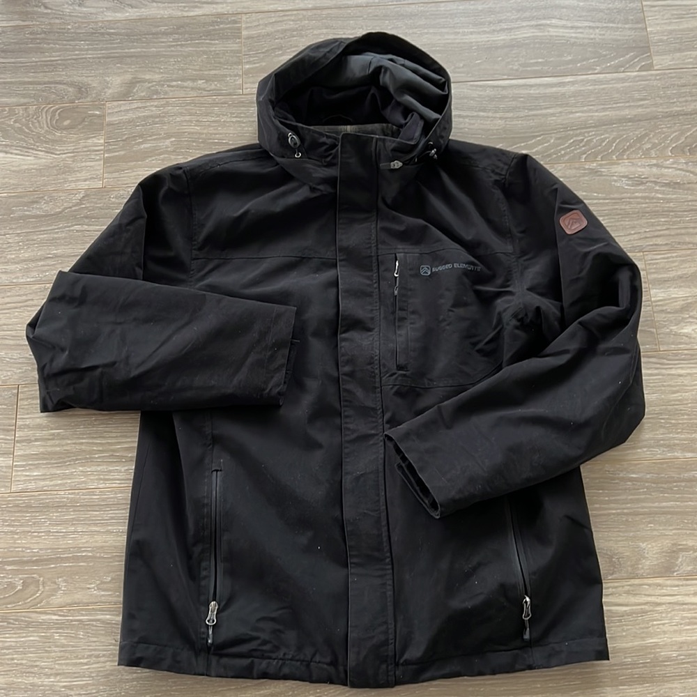 Fleece-lined windbreaker. Hood can disappear into zippered pouch.